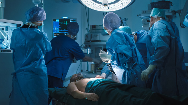 Doctors Defibrillating Patient