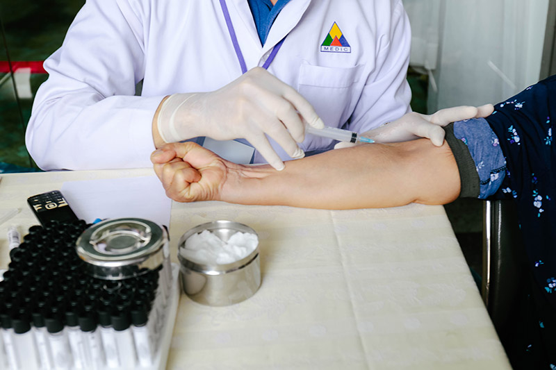 Doctor drawing blood